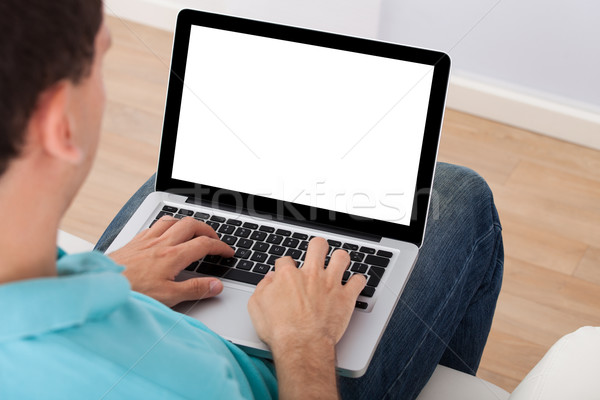 Homem usando laptop casa adulto computador casa Foto stock © AndreyPopov