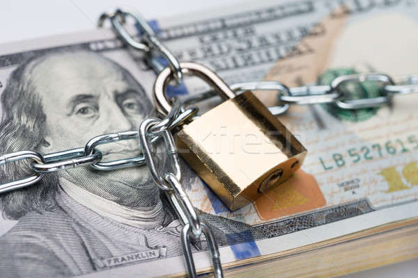 Chain And Padlock Around Dollar Bundle Stock photo © AndreyPopov