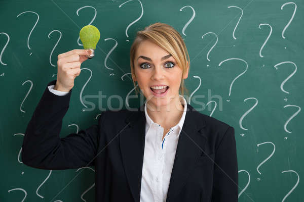 Stock photo: Businesswoman Holding Ecological Bulb