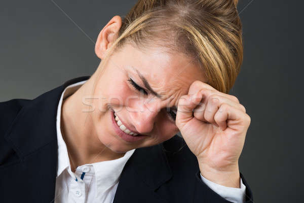 Depressed Businesswoman Banging Hand On Head Stock photo © AndreyPopov