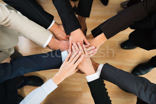 Business Team Stacking Hands On Table Stock photo © AndreyPopov