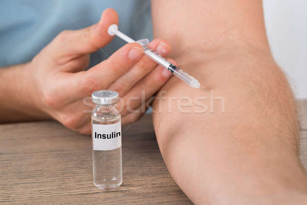 Diabetic Man Injecting Arm Stock photo © AndreyPopov