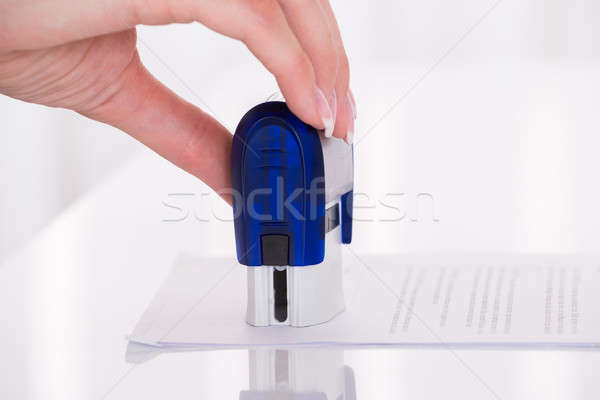 Person's Hand Stamping Document Stock photo © AndreyPopov