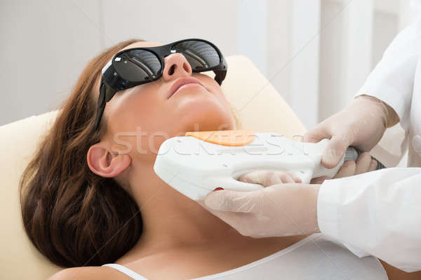 Woman Receiving Laser Hair Removal On Neck Stock photo © AndreyPopov
