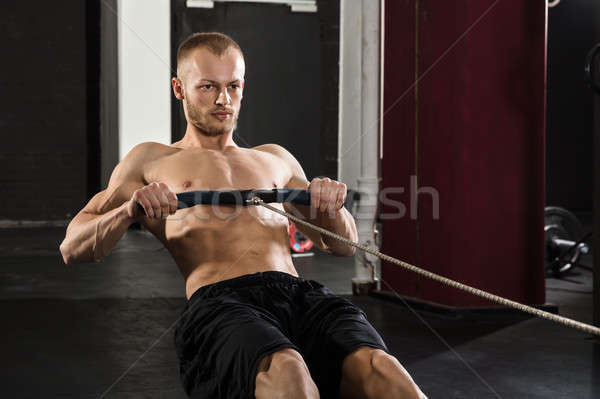 Jeune homme aviron machine portrait jeunes athlète [[stock_photo]] © AndreyPopov