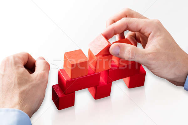 Person Building House With Red Blocks Stock photo © AndreyPopov