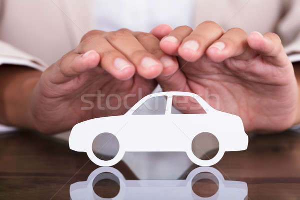 Person's Hand Protecting Car Cut Out Stock photo © AndreyPopov