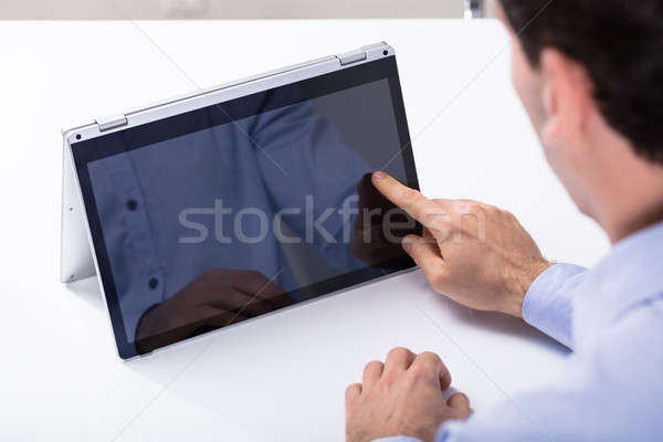 Adam dokunmak melez dizüstü bilgisayar ekran parmak Stok fotoğraf © AndreyPopov