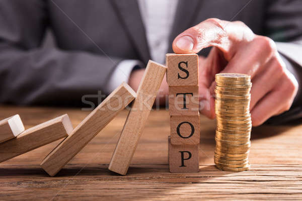 Human Finger Stopping Dominos From Falling Stock photo © AndreyPopov