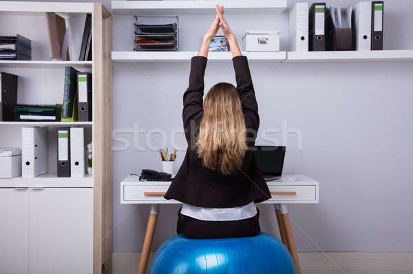 Hátsó nézet üzletasszony nyújtás karok ül fitnessz Stock fotó © AndreyPopov