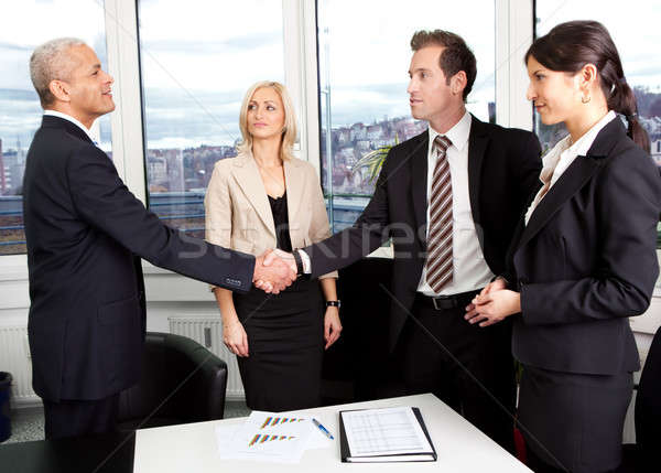 Affaires handshake face bureau femme affaires Photo stock © AndreyPopov