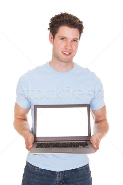 Junger Mann halten Laptop glücklich weiß Computer Stock foto © AndreyPopov