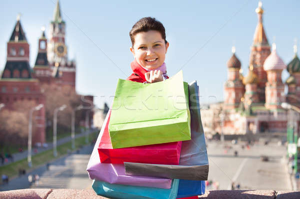 Fiatal nő bevásárlótáskák boldog sétál utca üzlet Stock fotó © AndreyPopov