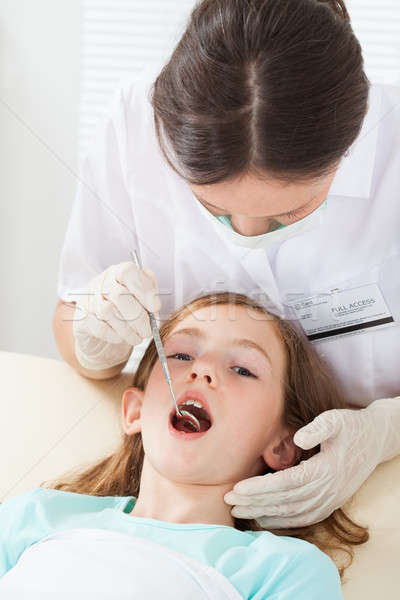 Girl Undergoing Dental Treatment Stock photo © AndreyPopov