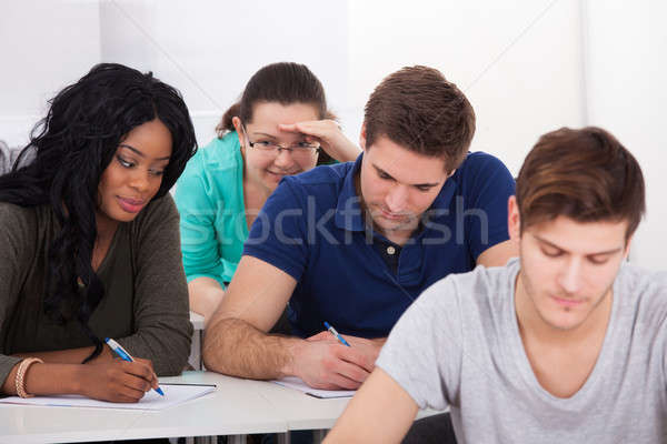 Female Students Trying To Cheat During Test Stock photo © AndreyPopov