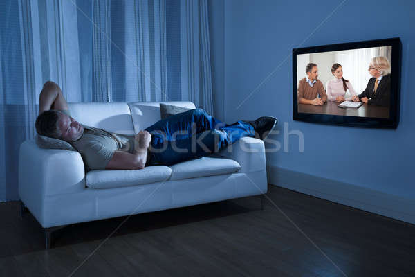 человека смотрят фильма диване домой бизнеса Сток-фото © AndreyPopov