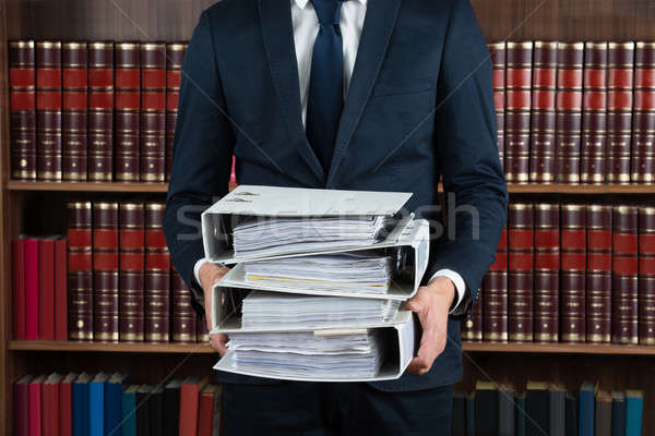 Lawyer Carrying Stack Of Ring Binders Stock photo © AndreyPopov