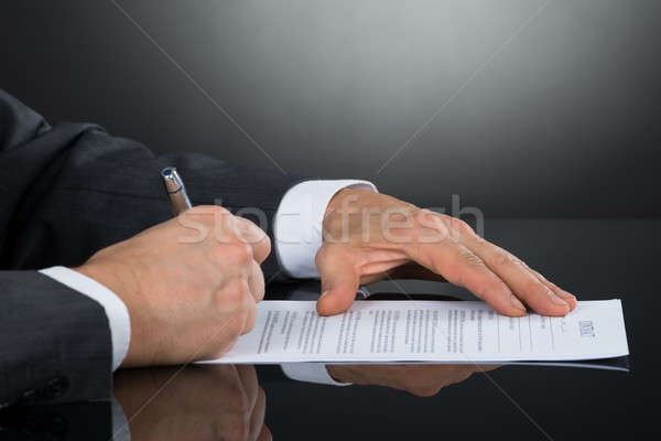 Close-up Of Businessperson Signing Contract Paper With Pen Stock photo © AndreyPopov