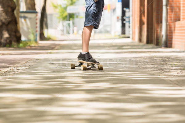 Boy Skating On Street Stock photo © AndreyPopov