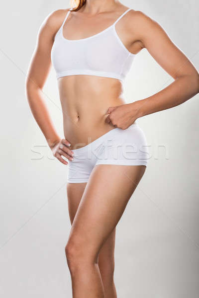 Gyomor kövér szürke háttér szépség testmozgás Stock fotó © AndreyPopov