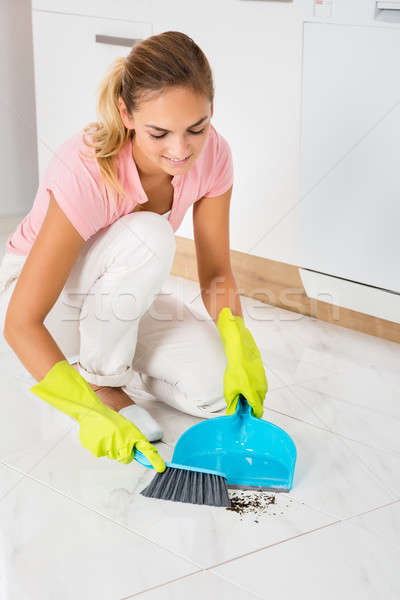 Woman Sweeping Floor With Broom And Dustpan Stock photo © AndreyPopov