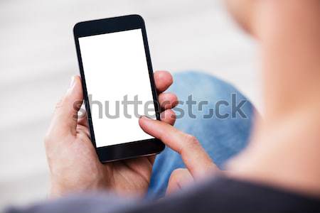 Close-up Of A Hand Holding Cell Phone Stock photo © AndreyPopov
