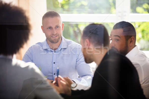 Csoport üzletemberek ül iroda üzleti megbeszélés férfi Stock fotó © AndreyPopov