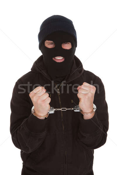 Przestępca zablokowany kajdanki zły biały ręce Zdjęcia stock © AndreyPopov