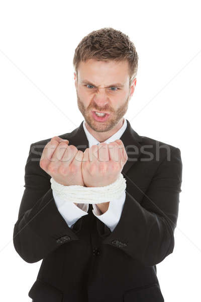 Frustrated Businessman Looking At Tied Hands Stock photo © AndreyPopov