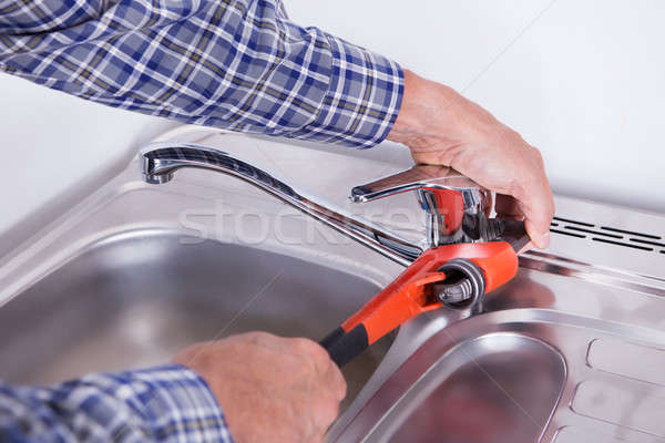 Plumber Fixing Washbasin Stock photo © AndreyPopov
