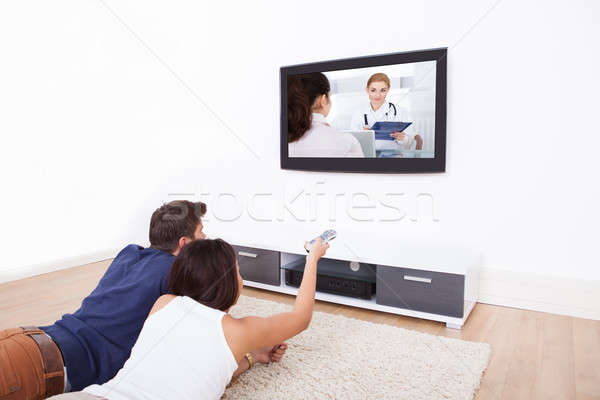Couple Watching TV At Home Stock photo © AndreyPopov