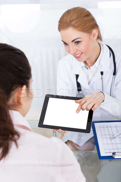 Doctor Showing Digital Tablet To Patient Stock photo © AndreyPopov