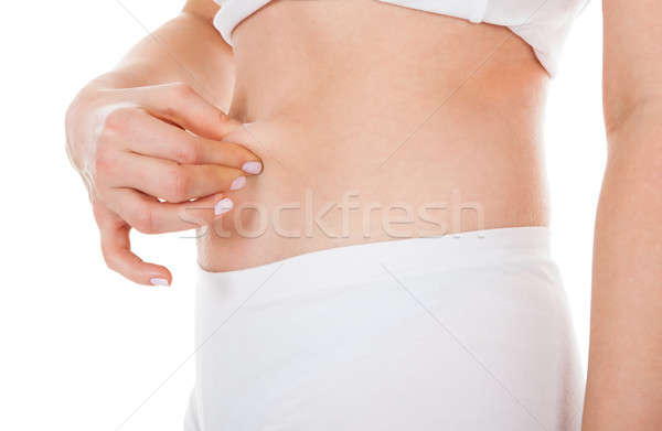 Woman Pinching Excessive Fat Stock photo © AndreyPopov