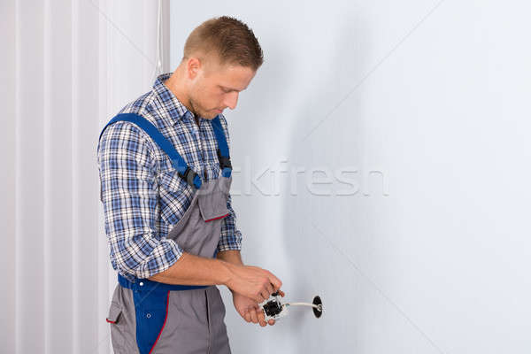Electrician Installing Electrical Socket Stock photo © AndreyPopov