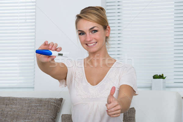 Stock photo: Woman Showing Positive Pregnancy Result