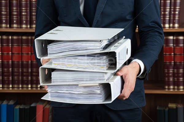 Lawyer Carrying Stack Of Ring Binders Stock photo © AndreyPopov
