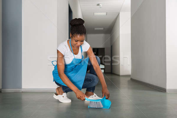Woman Sweeping Floor With Whisk Broom Stock photo © AndreyPopov