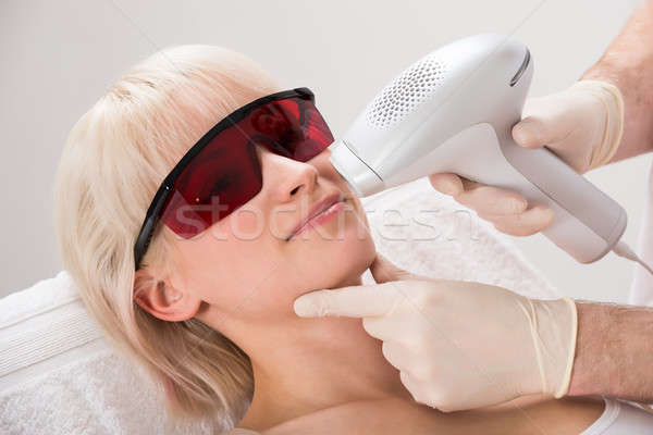 Woman Receiving Laser Epilation Treatment At Spa Stock photo © AndreyPopov