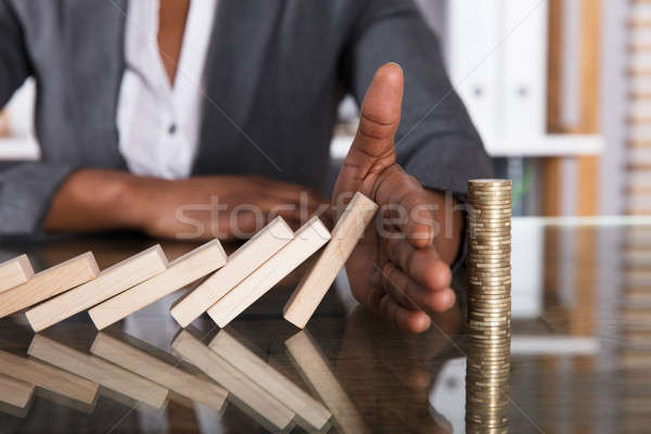 Emberi kéz tömés fakockák zuhan egymásra pakolva érmék Stock fotó © AndreyPopov