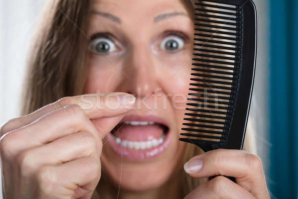 Shocked Woman Losing Hair Stock photo © AndreyPopov