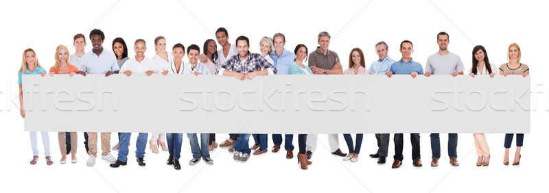 Group of business people with a blank banner Stock photo © AndreyPopov