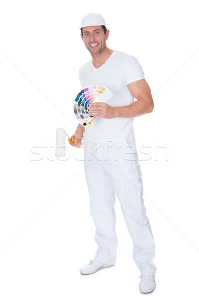 Painter Holding A Paint Roller And Spectrum Stock photo © AndreyPopov