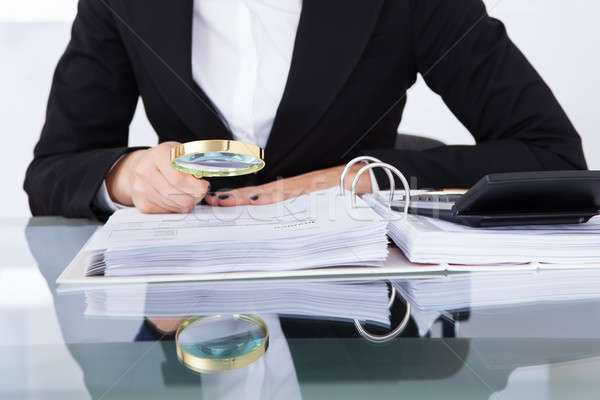 Auditor Scrutinizing Financial Documents Stock photo © AndreyPopov