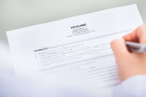 Hand With Pen And Curriculum Vitae Stock photo © AndreyPopov