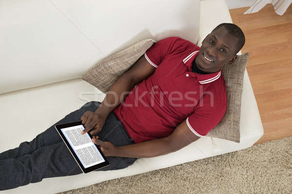 Man Holding E-book Stock photo © AndreyPopov