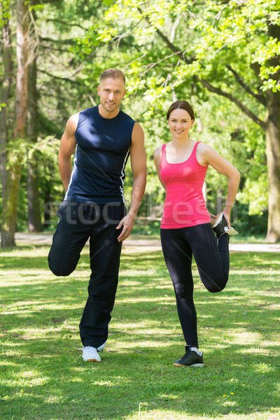 Couple Doing Exercise In Park Stock photo © AndreyPopov