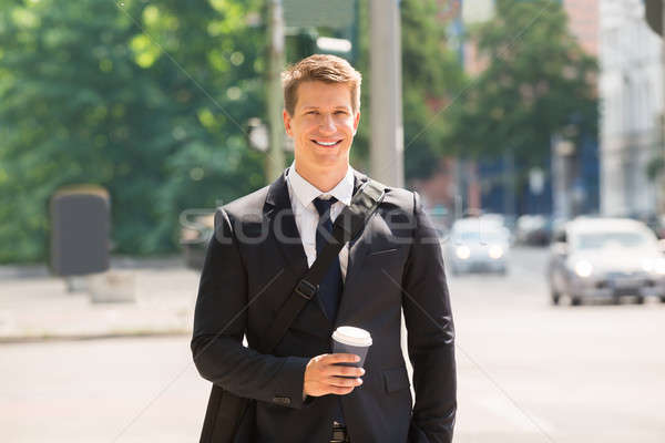 Young Businessman Walking On Street Stock photo © AndreyPopov
