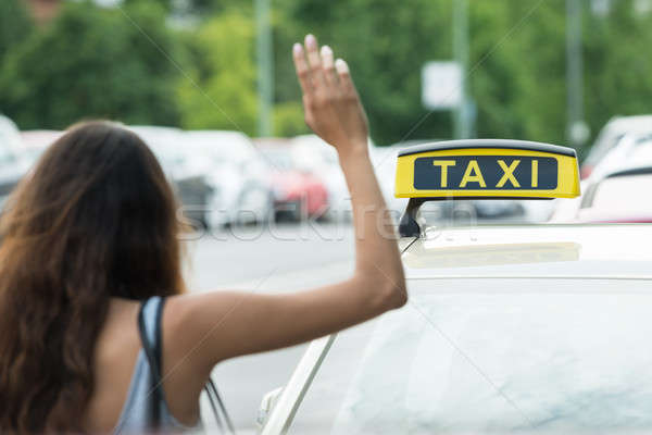 Woman Calling For Taxi Stock photo © AndreyPopov