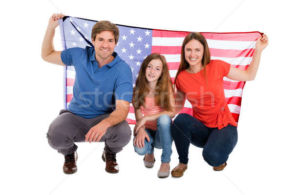 Famiglia bandiera americana sorridere bianco uomo Foto d'archivio © AndreyPopov