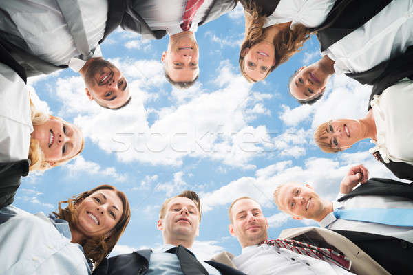 Businesspeople Forming Huddle Stock photo © AndreyPopov